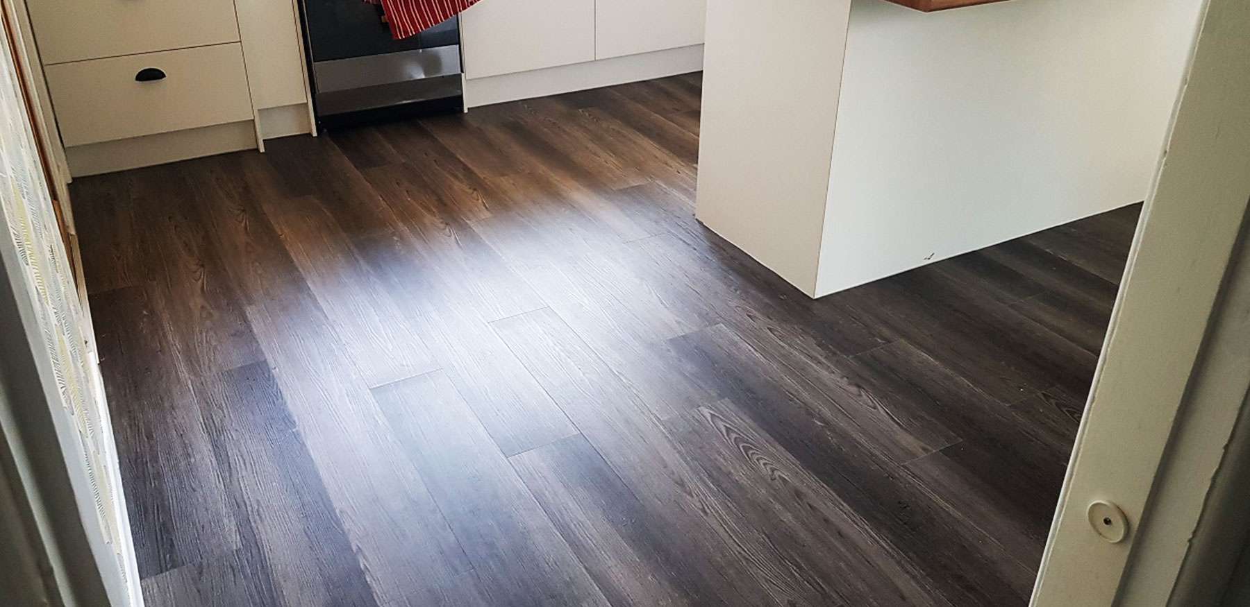 DualCore SPC Grey Oak flooring in a living room with modern decor