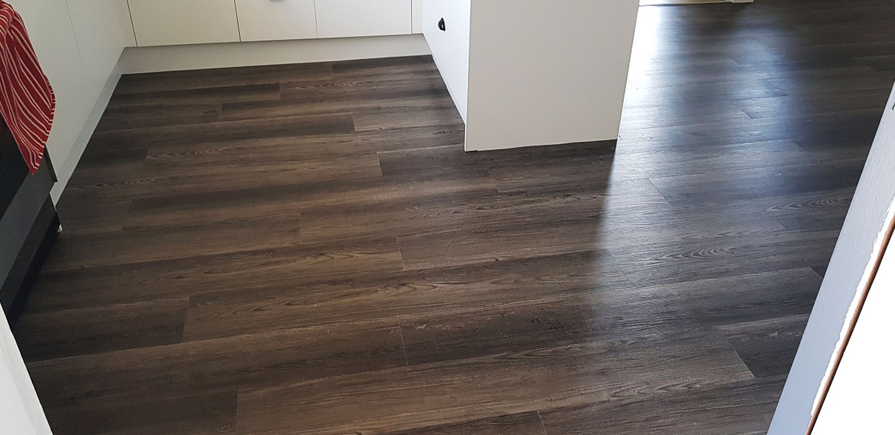 DualCore SPC Grey Oak flooring close-up showing stone plastic composite layers